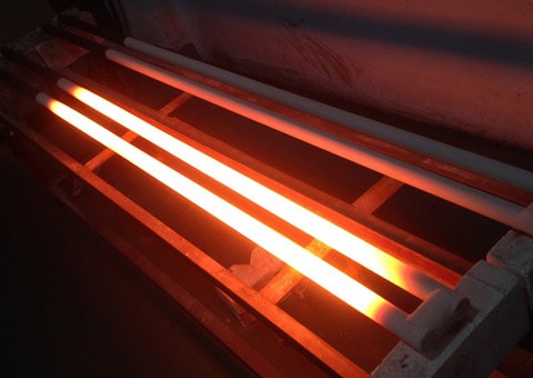 The silicon Carbide heating element is energized and heated